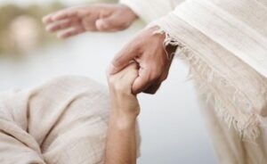 “Jesus holding a person’s hand in comfort and healing – Bible verses about healing and faith in God”